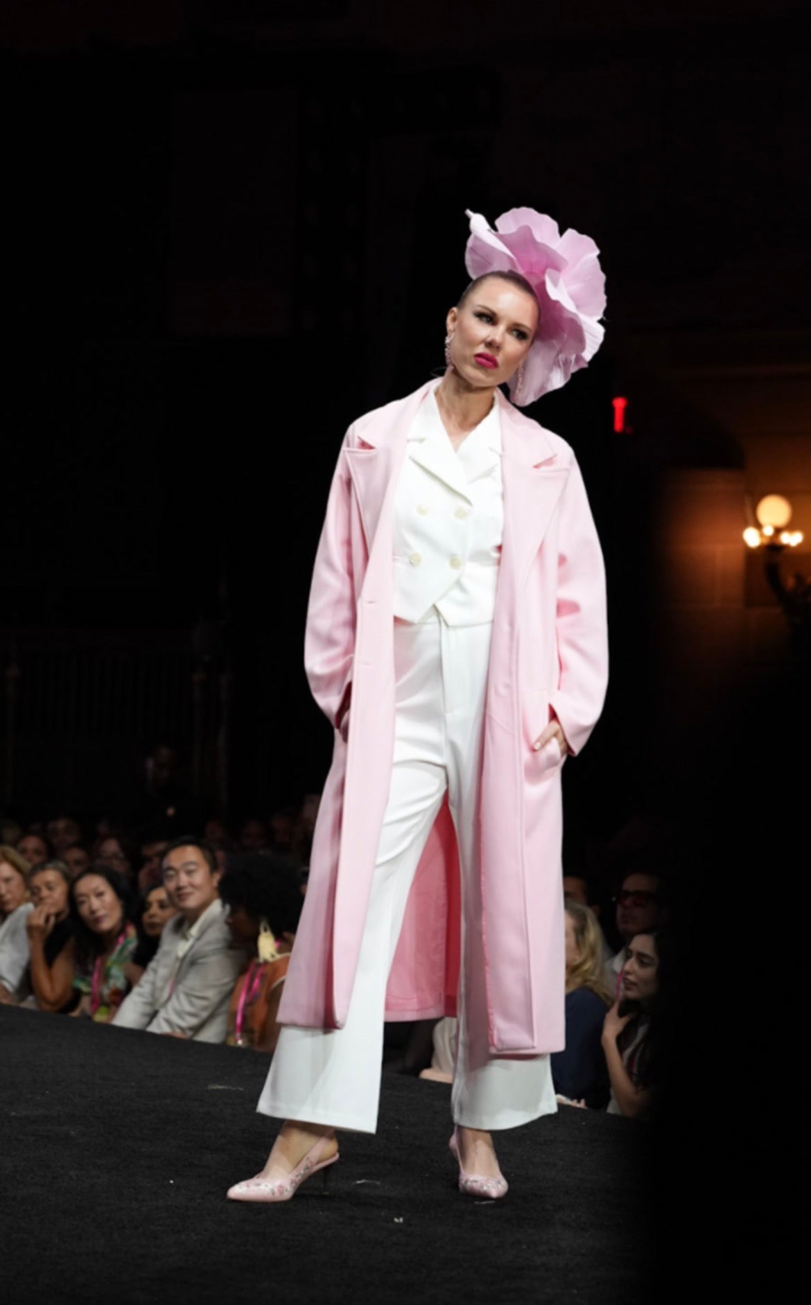 Model wearing a pink coat, white suit and Strawberry Flowers slingbacks at New York Fashion Week